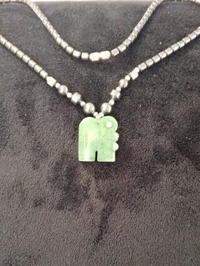Carved Green Elephant Pendant on Dark Beaded Necklace
